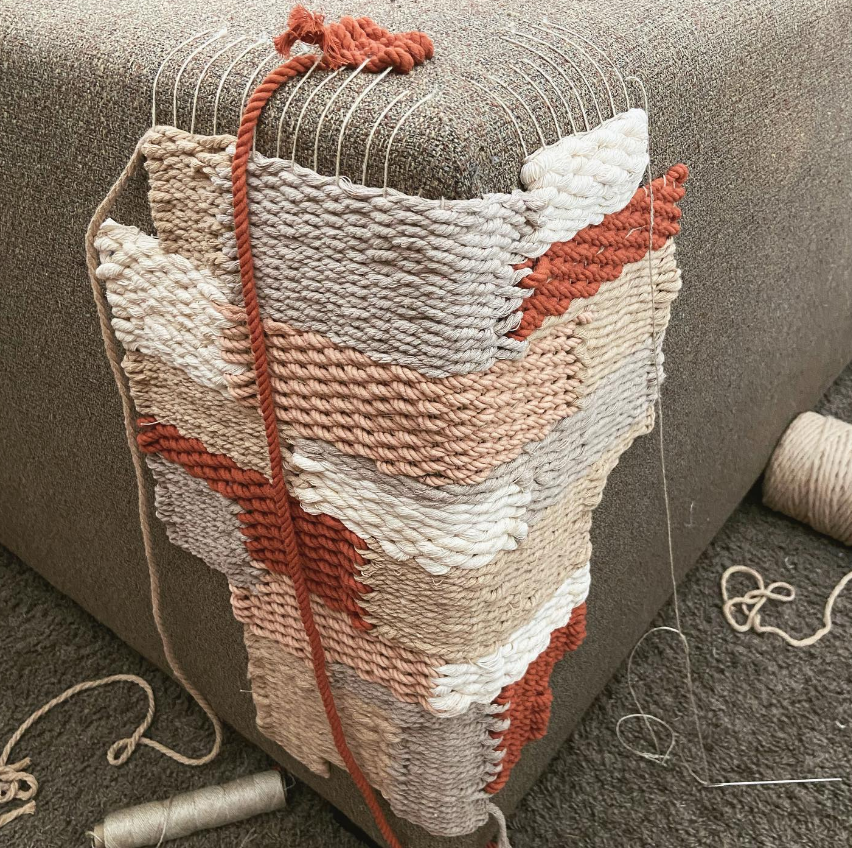 photograph demonstrating visible/decorative mending on the side of a couch